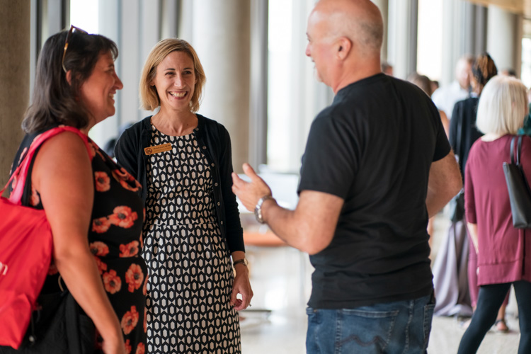 Members of the Alumni and Parents Admission Program socialize with each other