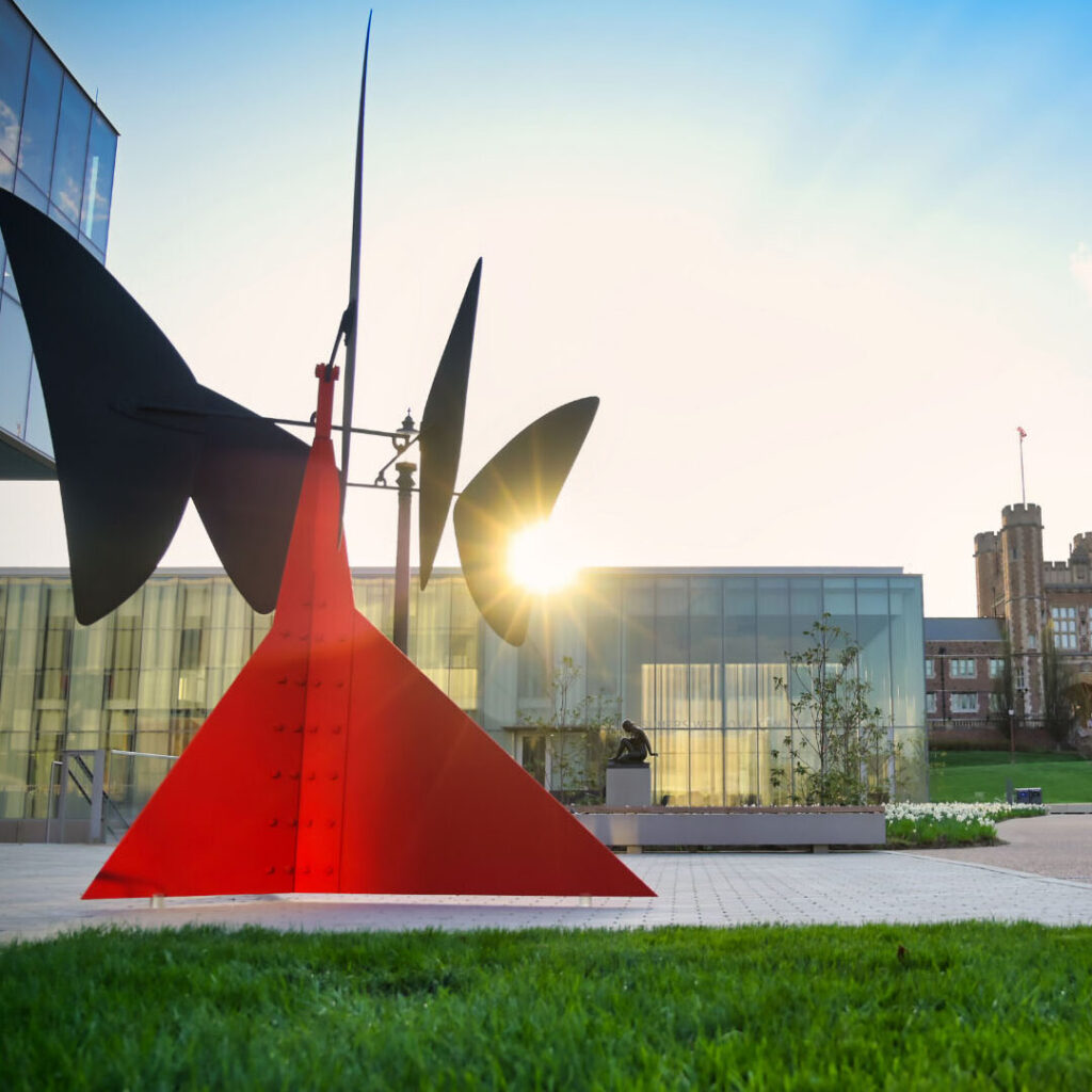 Sunset over Gary M. Sumers Welcome Center with Brookings Hall in the background