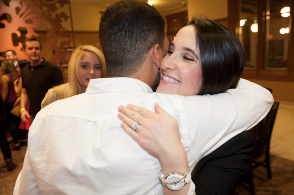 Class of 2010 alums hug