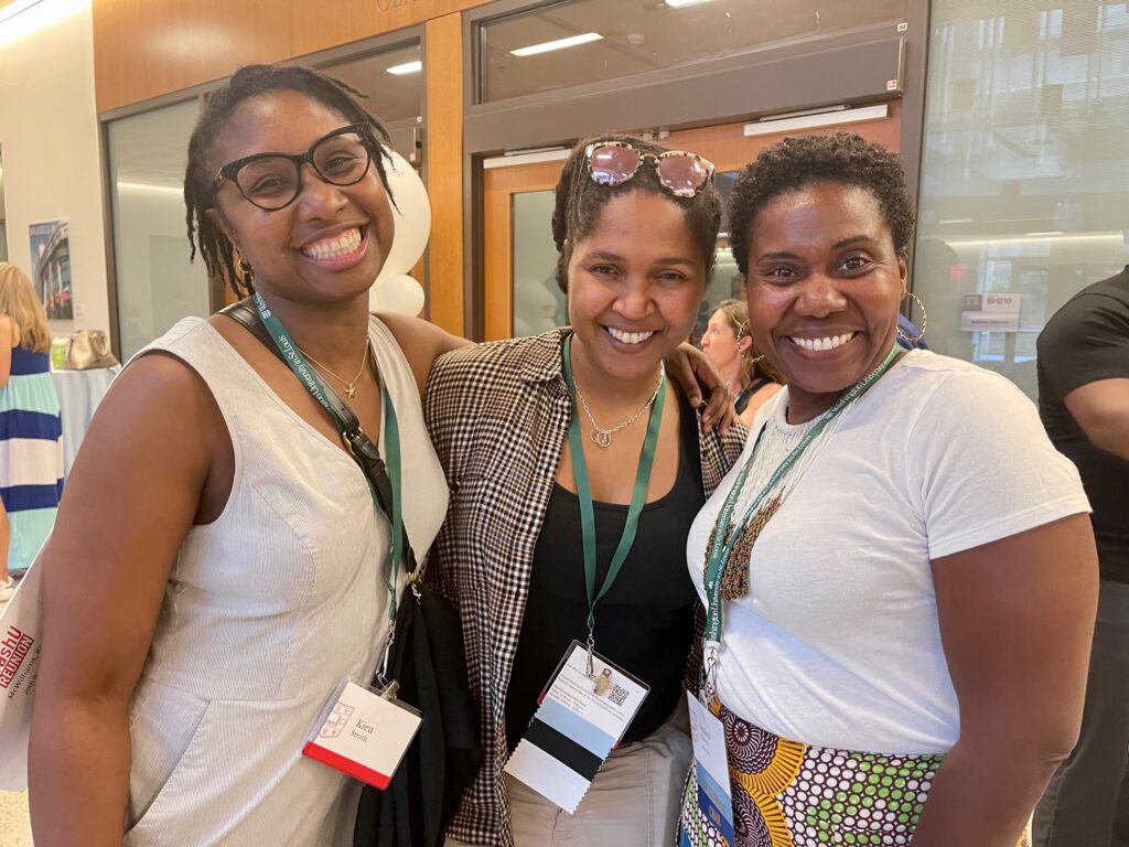 Three smiling reunion celebrants.