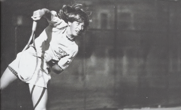 Black and white photo of a woman playing tennis