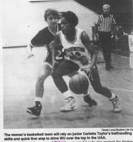 Black and white photo of two women playing in a basketball game