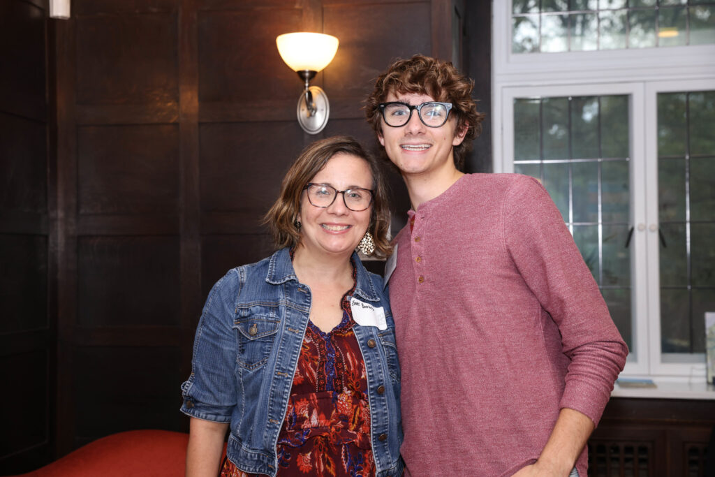 Two alums pose for the camera during the WUpan turns 10 reception in October 2023