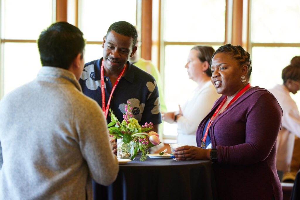 A group of alums talking during the 2024 WashU Pride alumni network reception