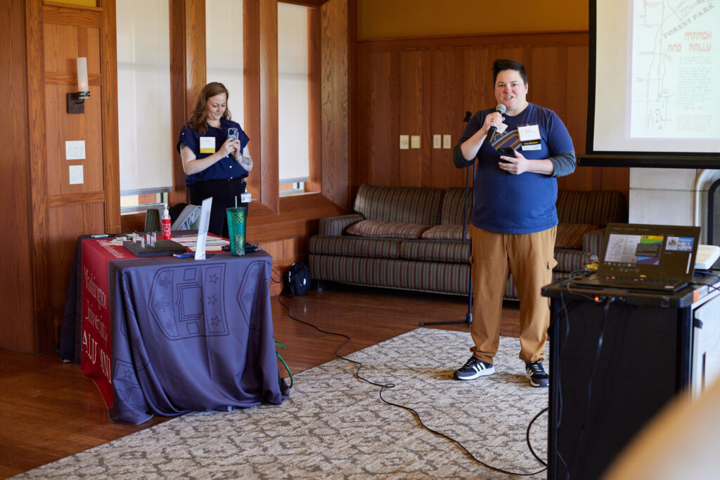 Becky Chmielewski, BFA ’04, WashU Pride Alumni Network City Representative – Chicago - giving a speech during the 2024 WashU Reunion