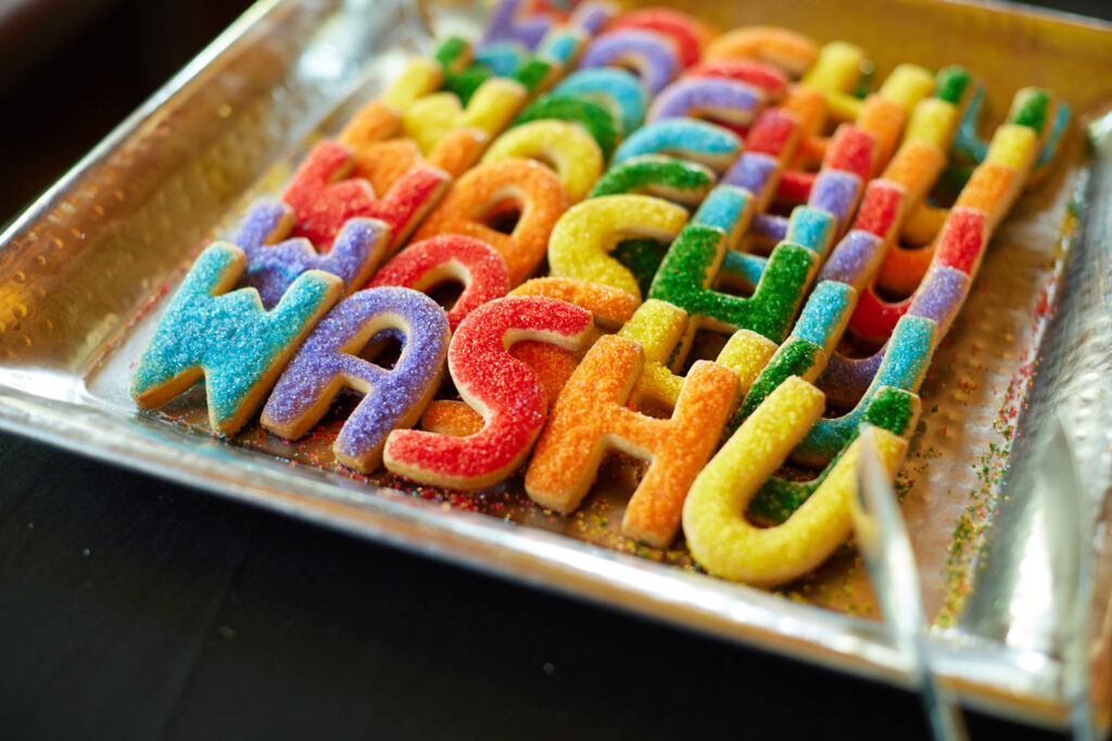 Cookies shaped as WashU in rainbow colors