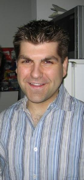 Color photo of a man in a striped shirt