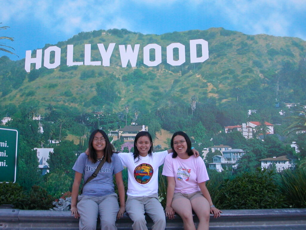 Three WashU students in front of the Hollywood sign