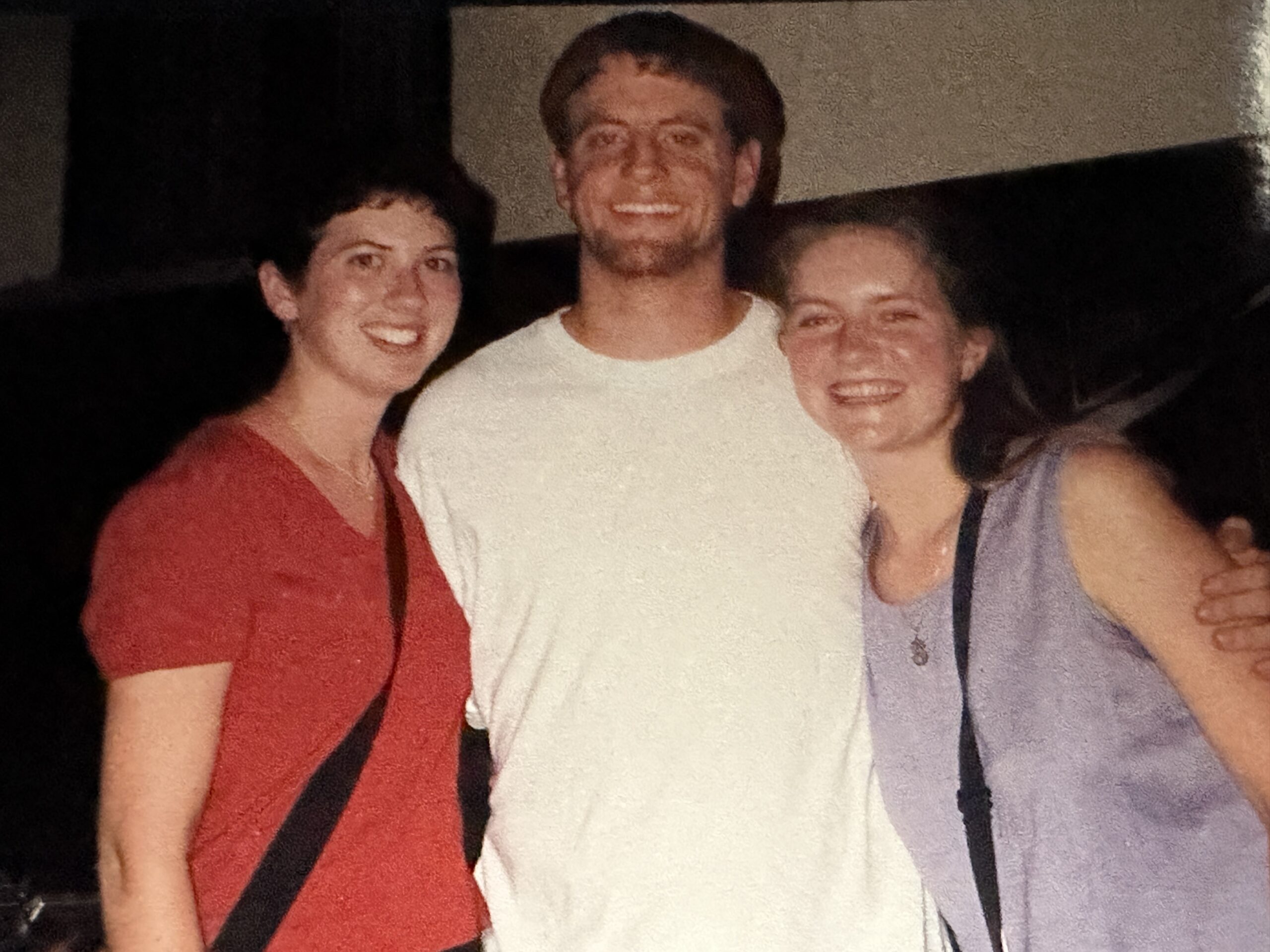 Three students pose for a photo