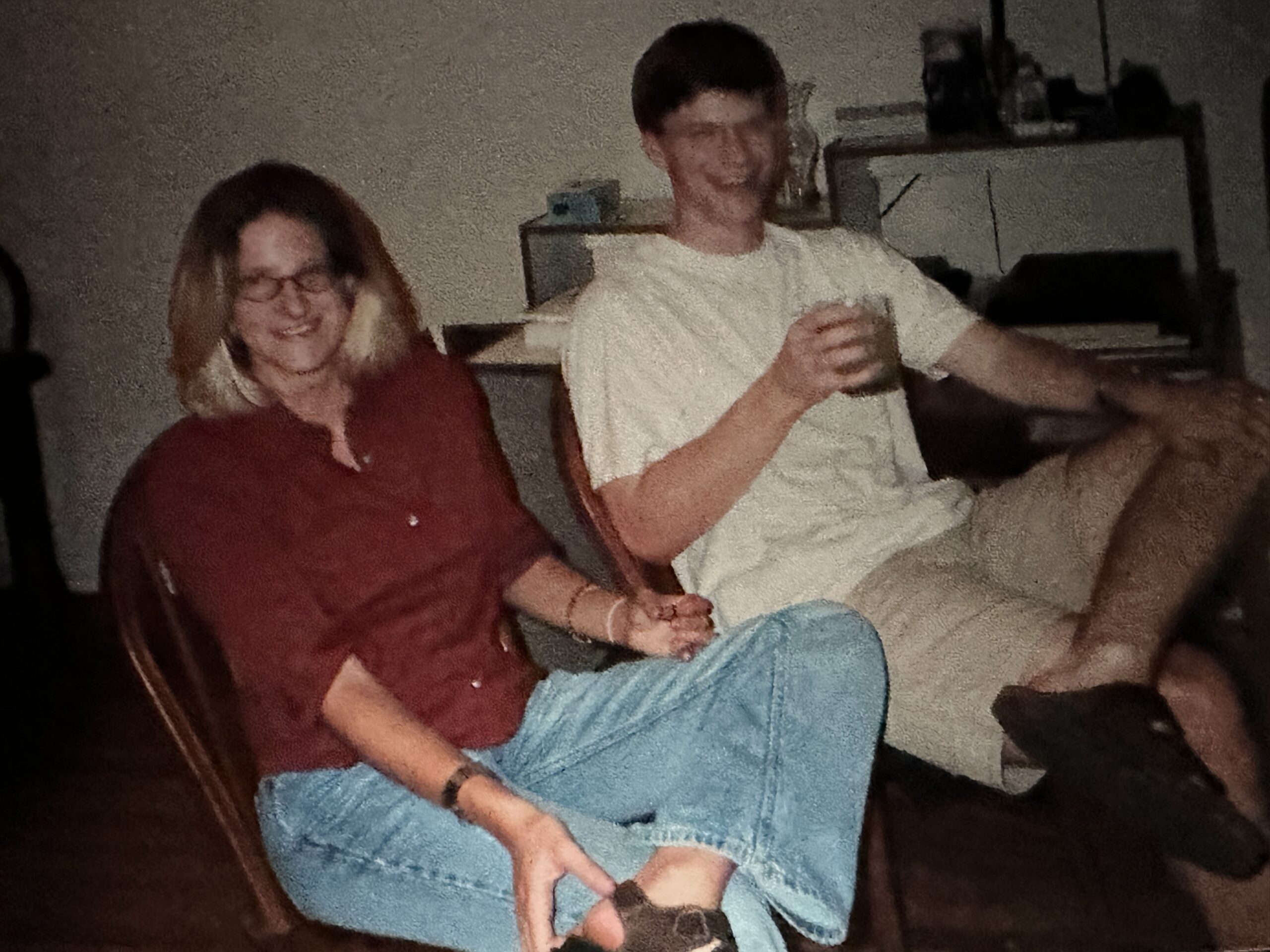 Two students lounging on the couch