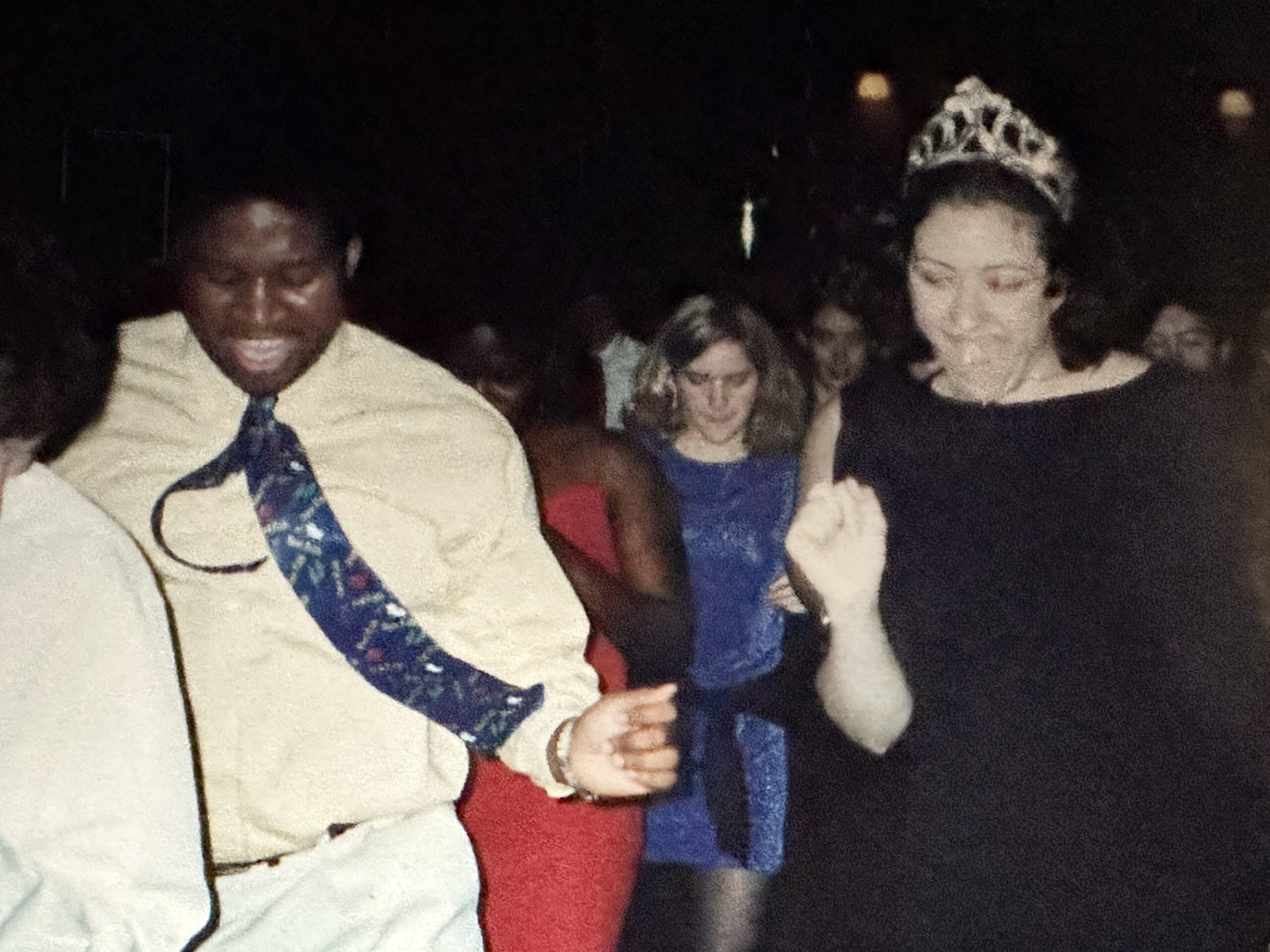 Two students dance at a party