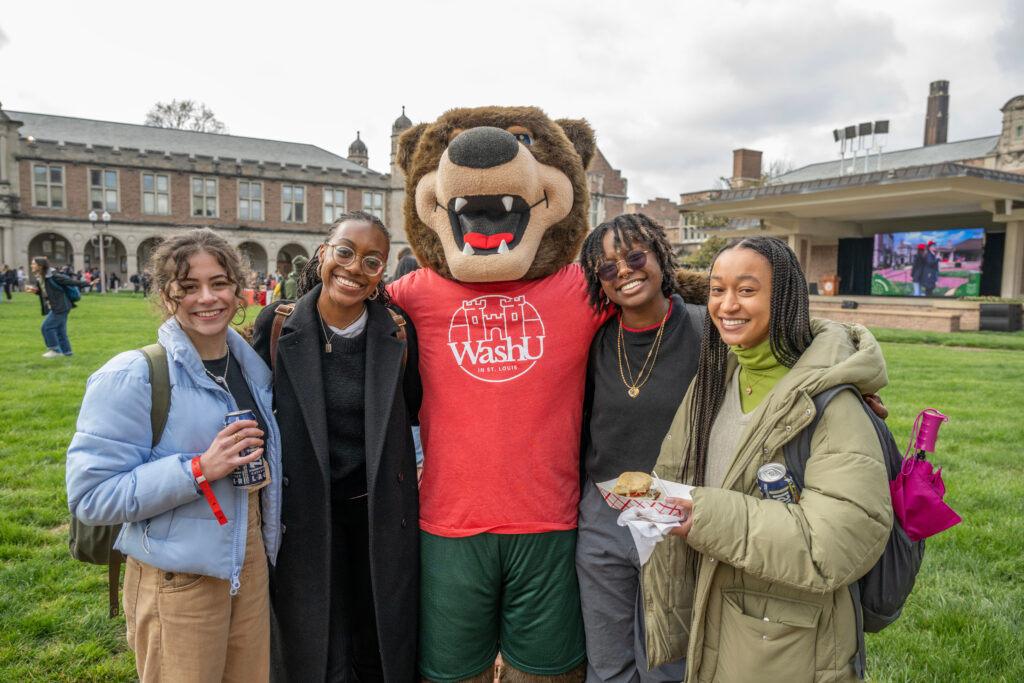 WashU's mascot poses with members of the Class of 2023