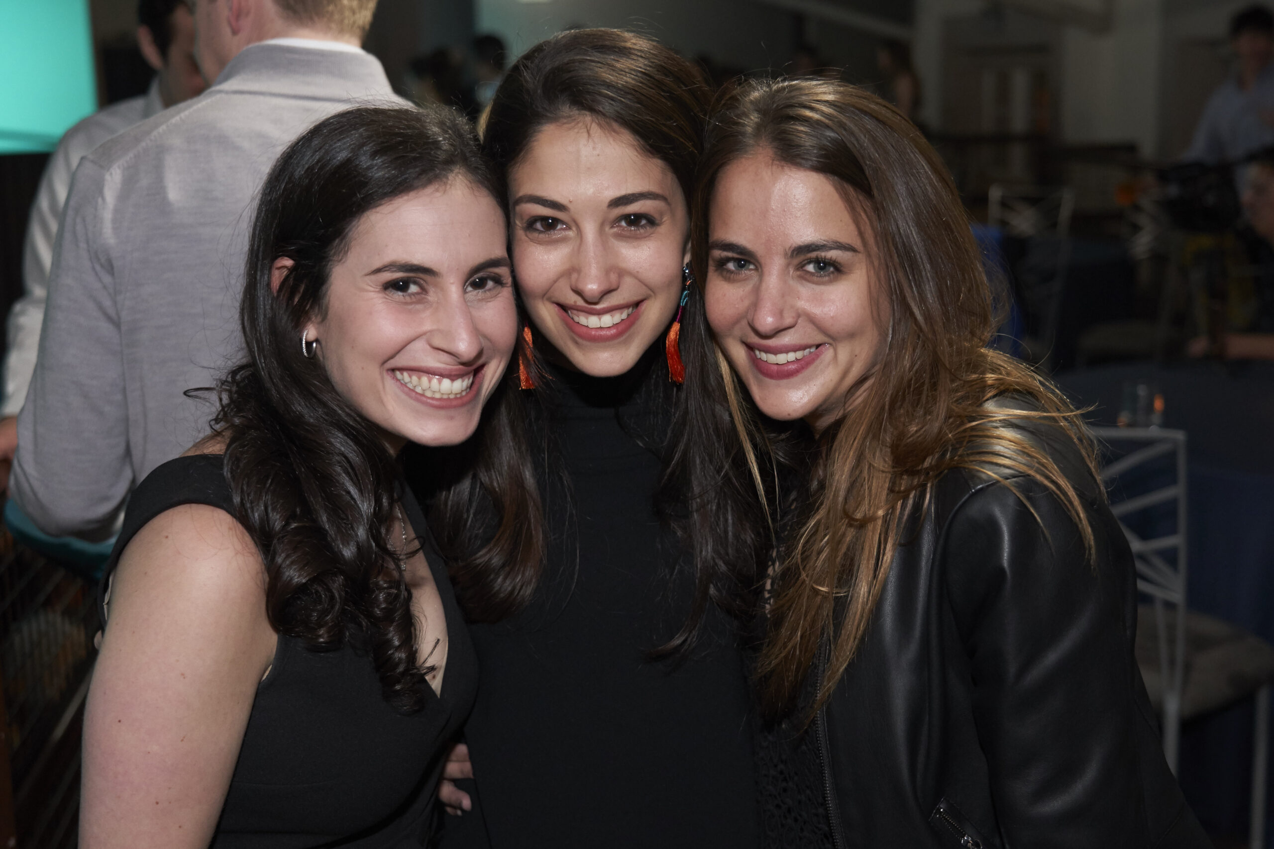 three women smile while attending their 5th class reunion in 2019