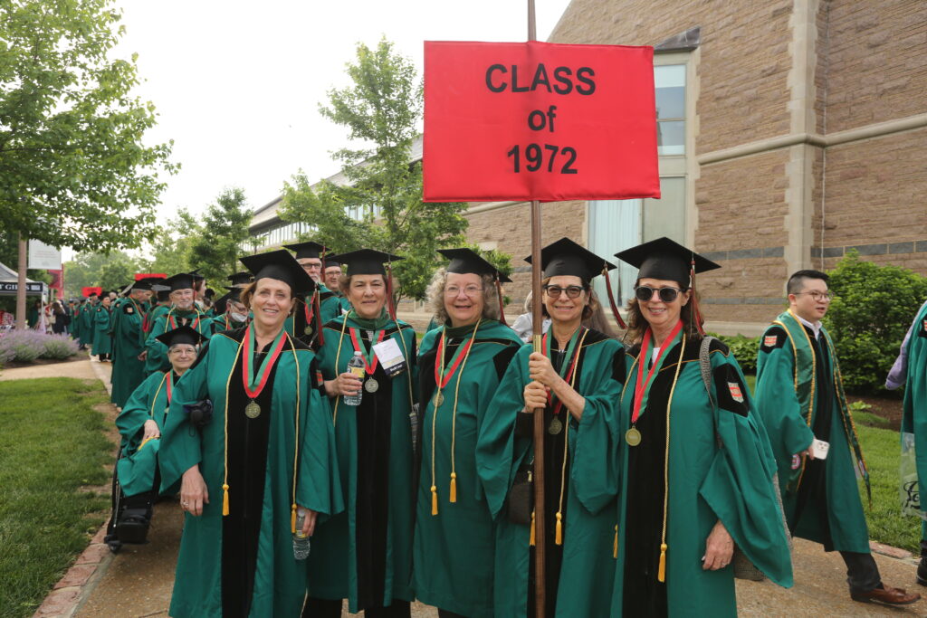 Members of the Class of 1972 hold their class banner before marching to Commencement