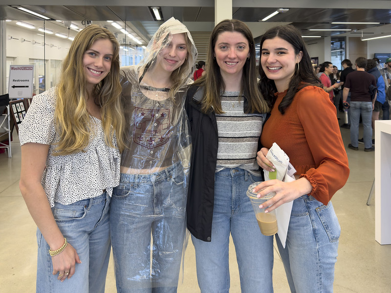 Four alumnae pose for a picture during WashU Barbecue event
