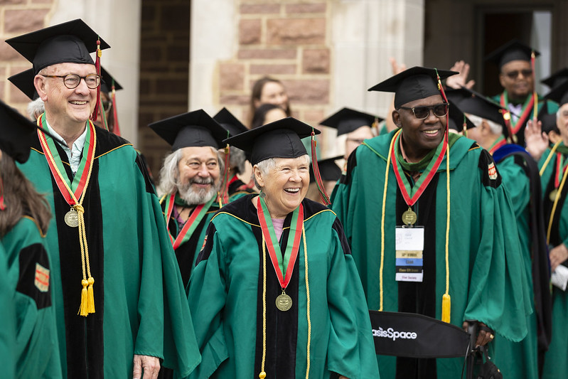 Four members of the Class of 1973 prepare to lead the procession at Commencement in 2023