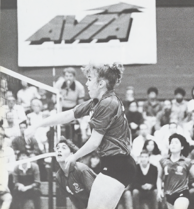 Black and white photo of a female volleyball player