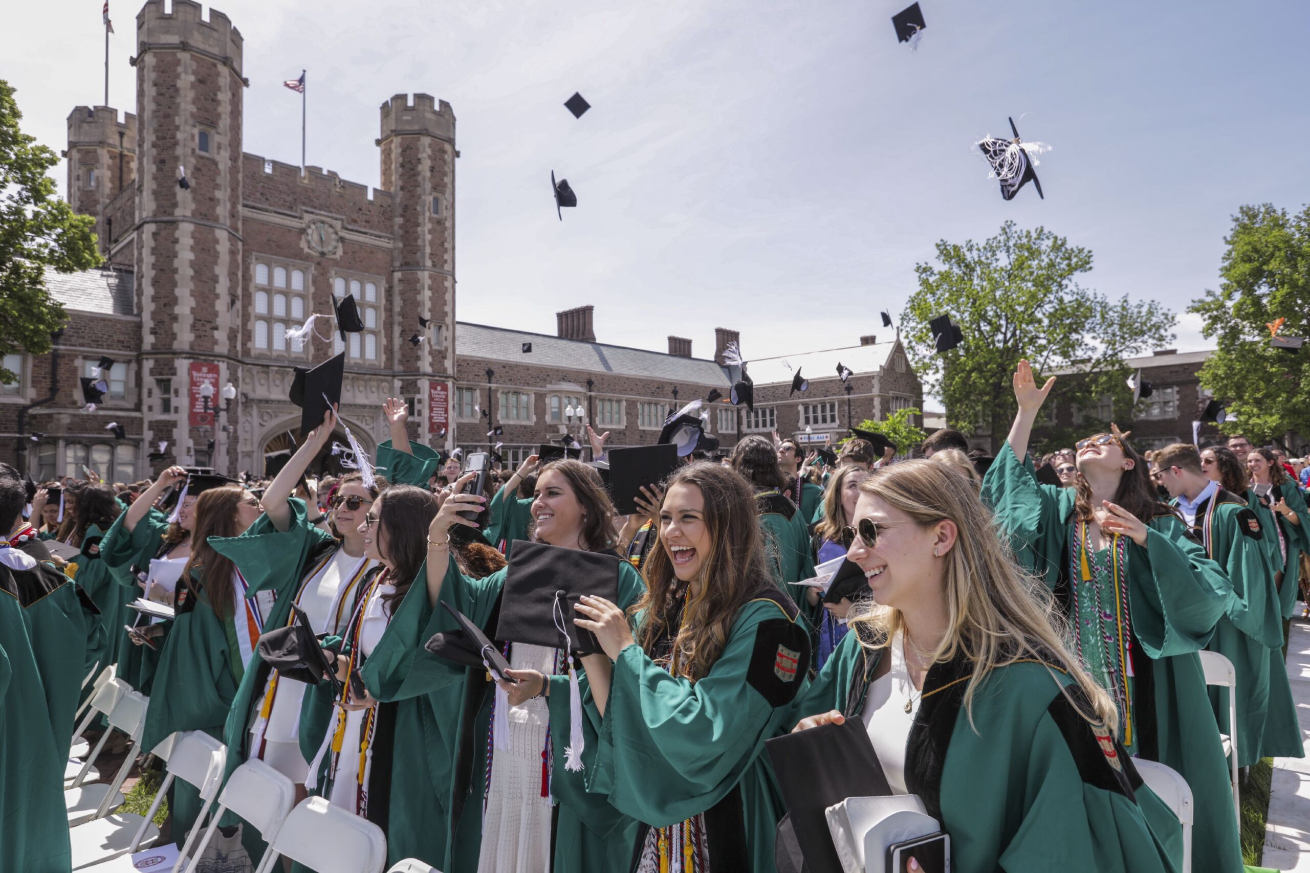 WashU students at commencement in front of Brookings Hall